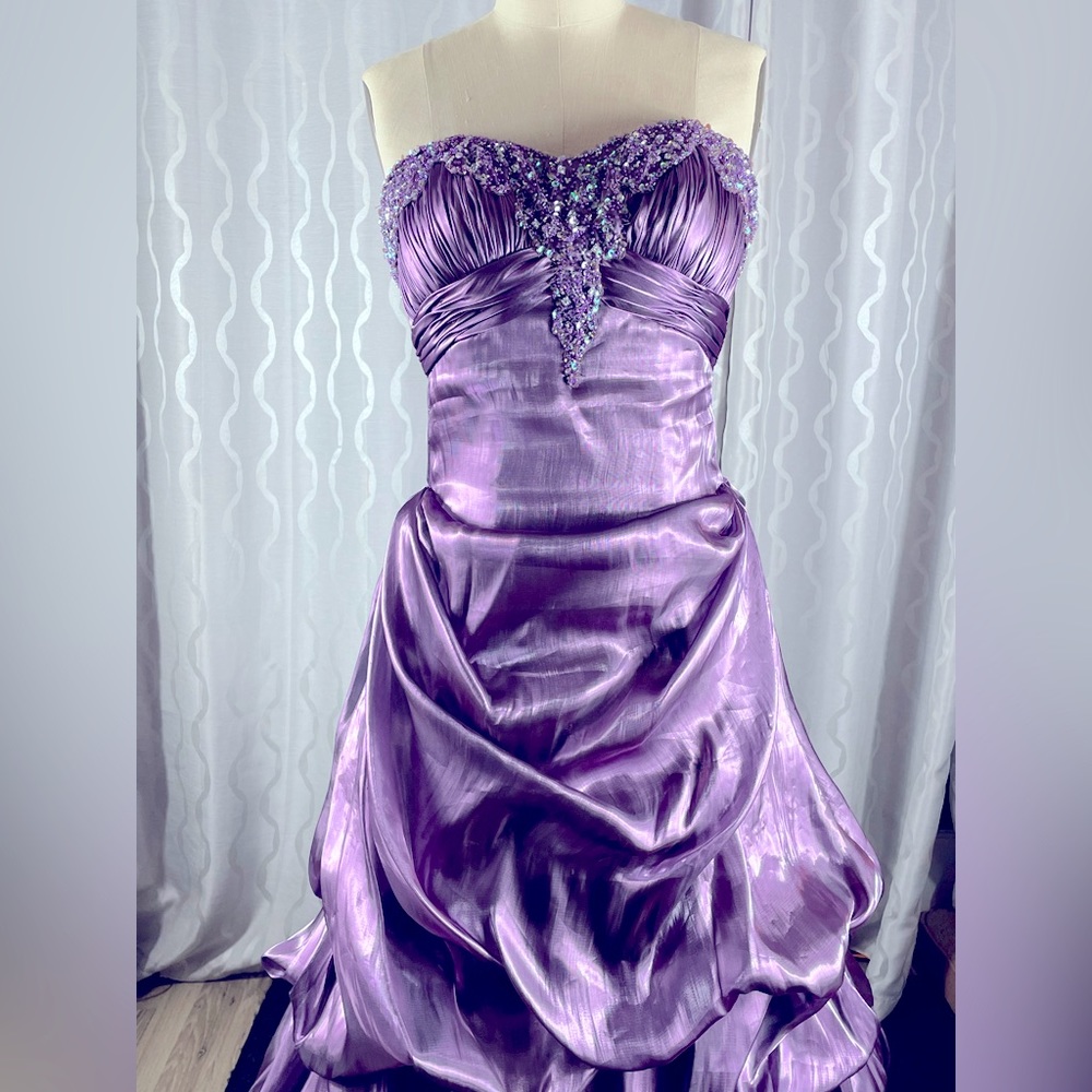 This royal purple Alyce Design dress is brand new and very elegant.